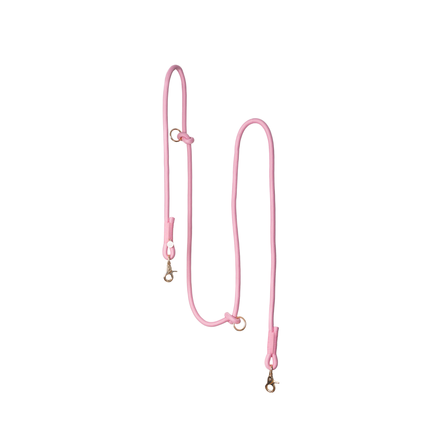 Pink dog leash on a light gray background