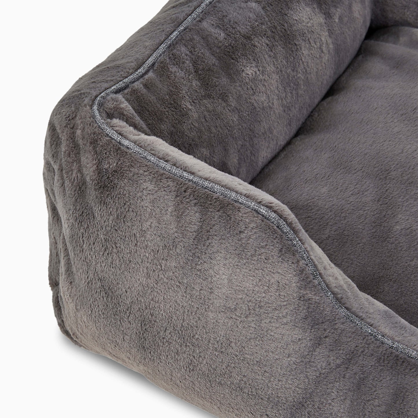 Close-up of a gray plush pet bed with soft texture