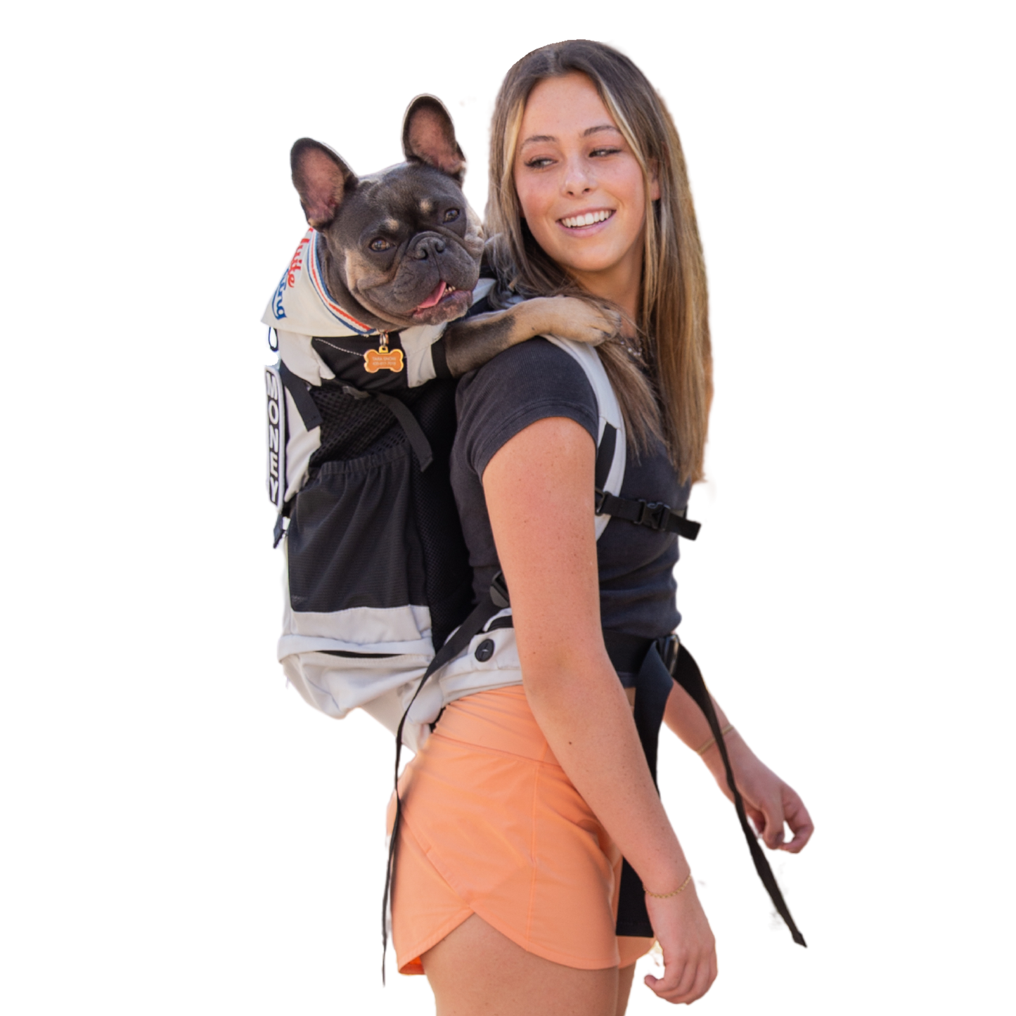Woman carrying a small dog in a backpack on a white background