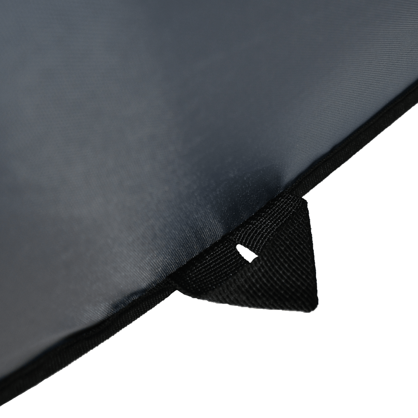 Close-up of a black umbrella with a white label on a white background
