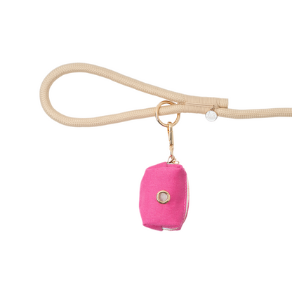 Pink dog leash holder with a gold ring on a white background