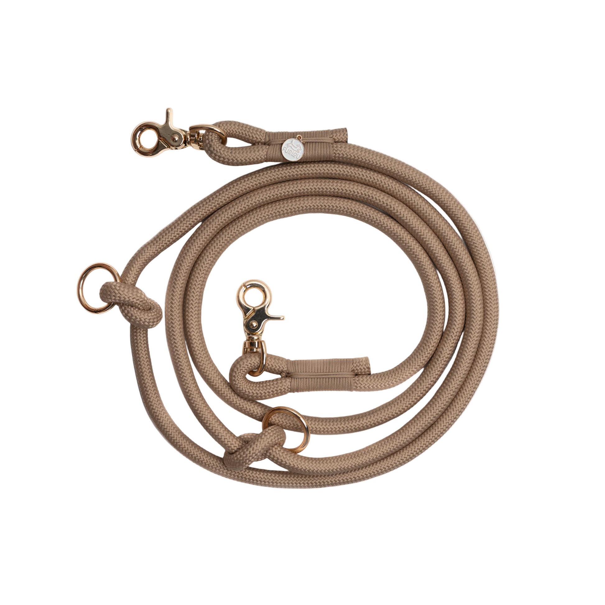 Beige dog leash with brass hardware on a white background