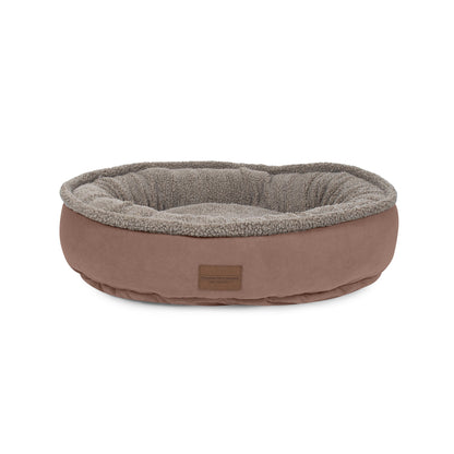 Brown pet bed with gray interior on a white background