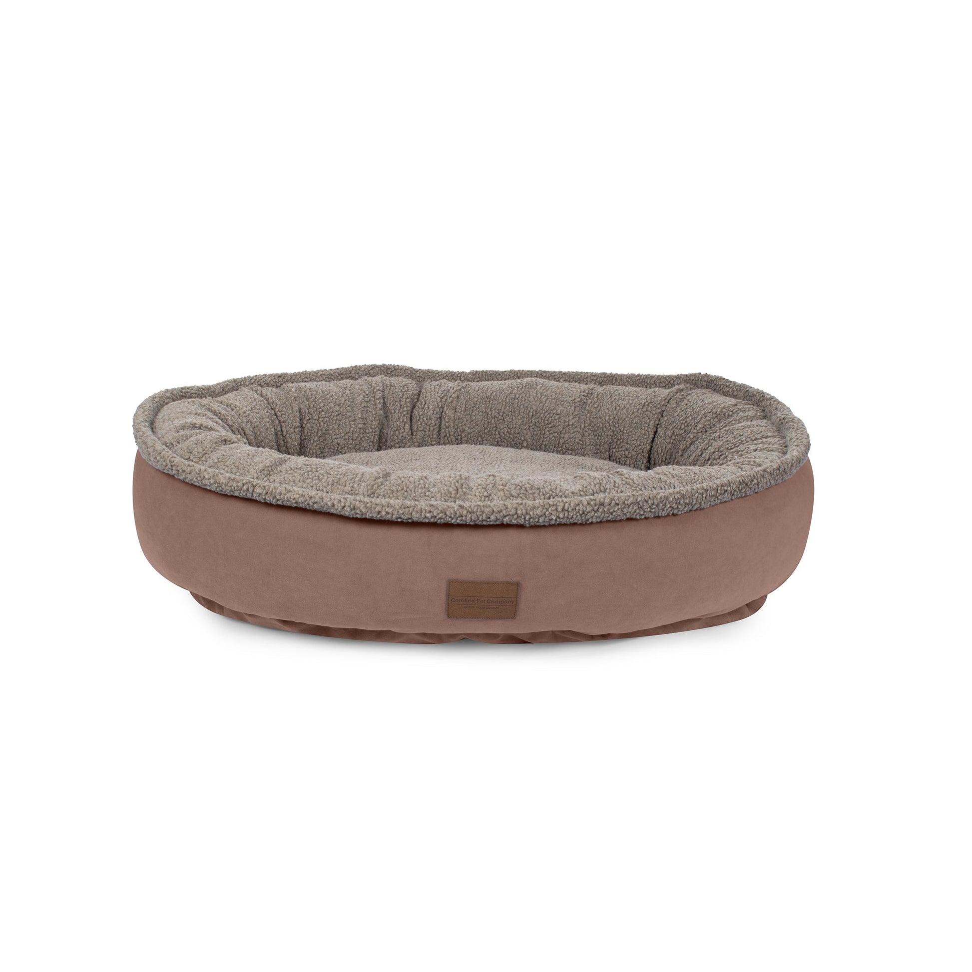 Dog bed with brown exterior and gray interior on a white background