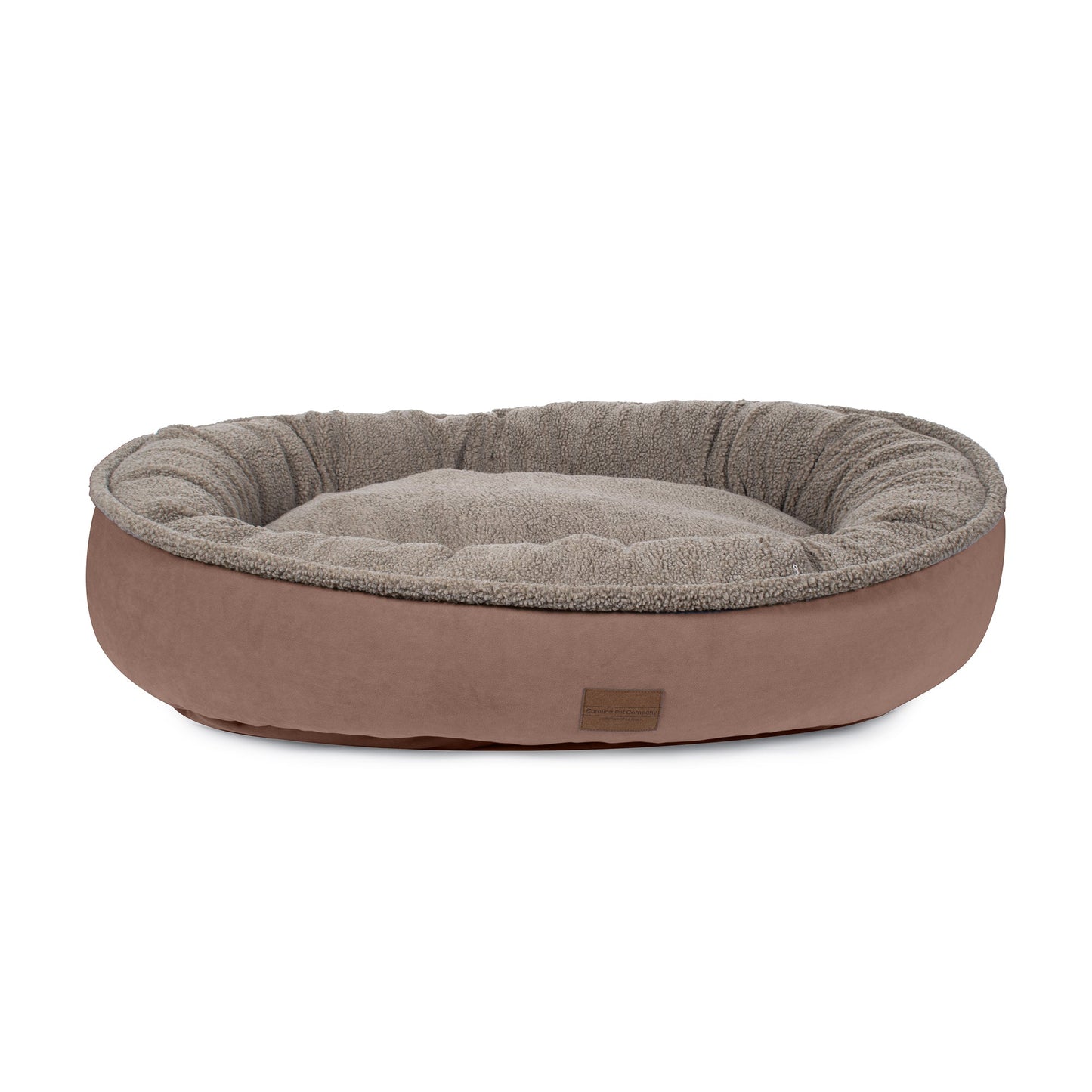 Dog bed with brown exterior and gray interior on a white background