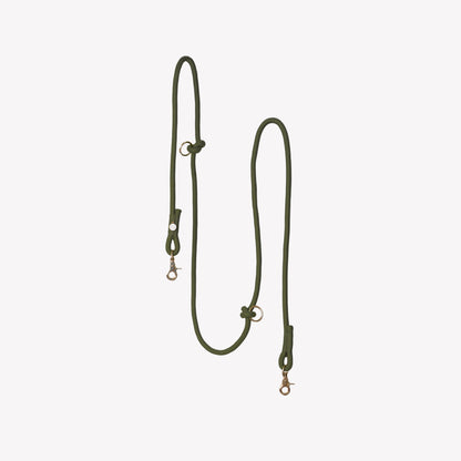 Green dog leash on a light gray background