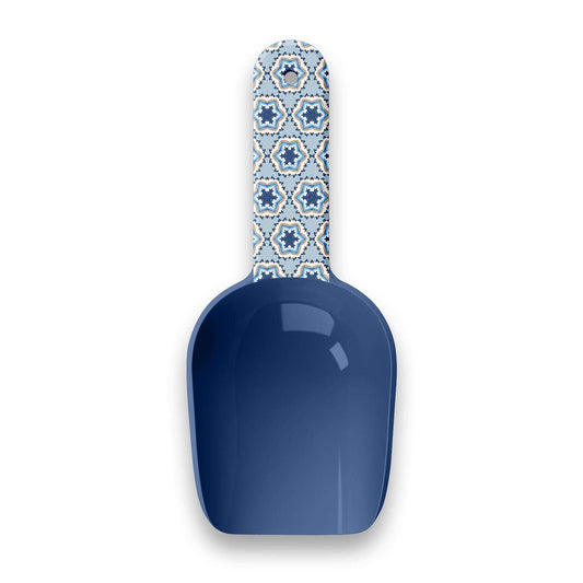 Blue scoop with a patterned handle on a white background
