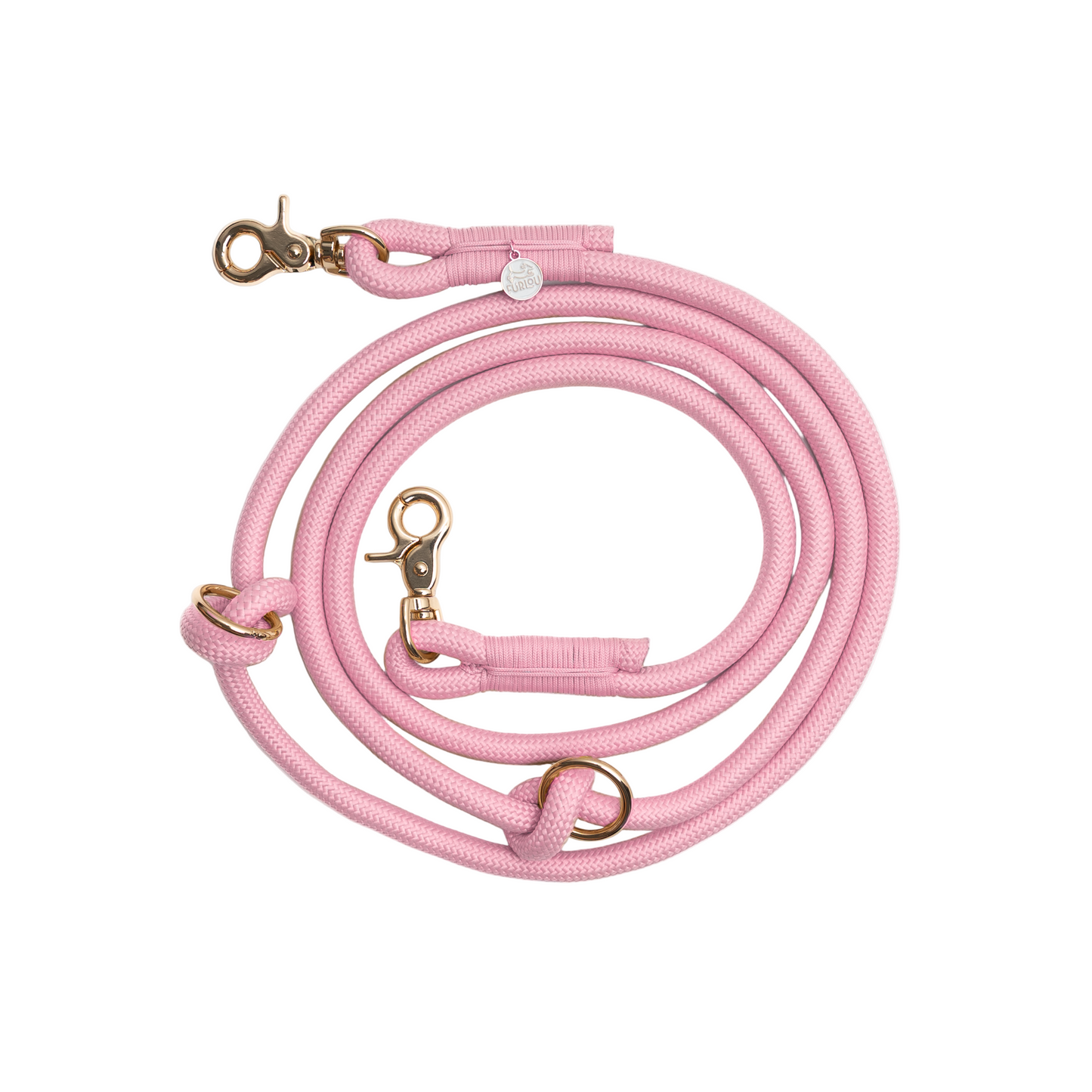 Pink dog leash with gold hardware on a white background