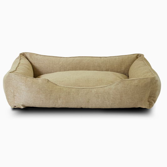 Beige pet bed on a white background