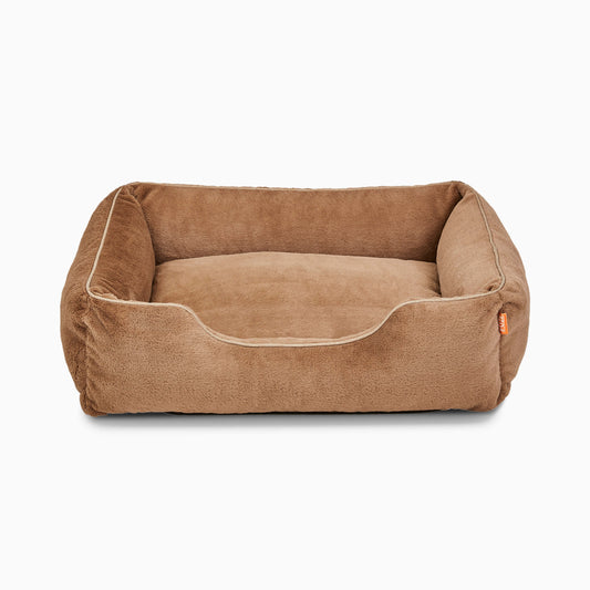 Brown pet bed on a white background