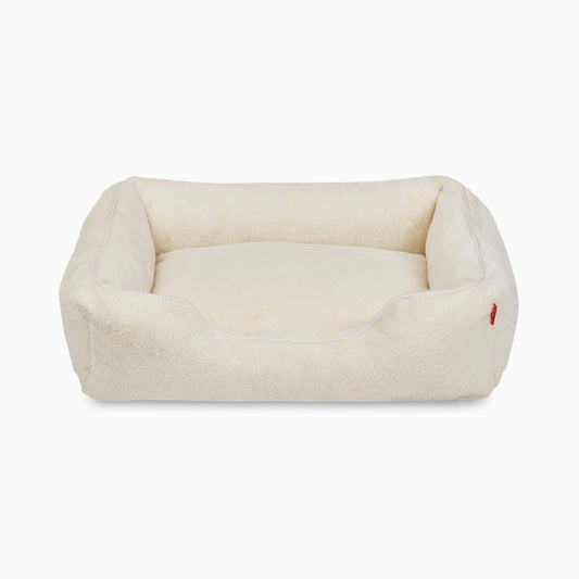 Beige pet bed on a white background