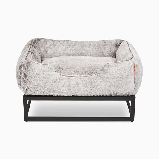 Gray pet bed with black metal frame on a white background