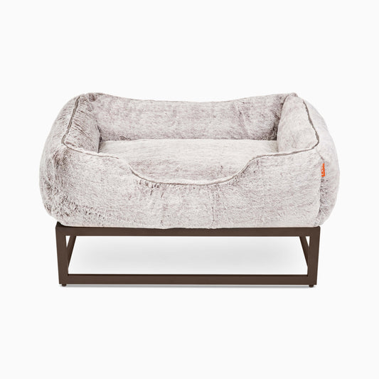The FÜZI Dog Bed in gray on top of frame on white background