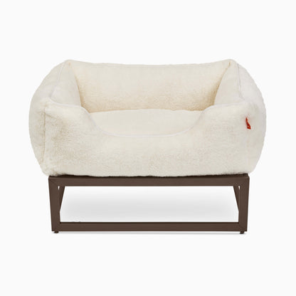 White pet bed with brown frame on a white background