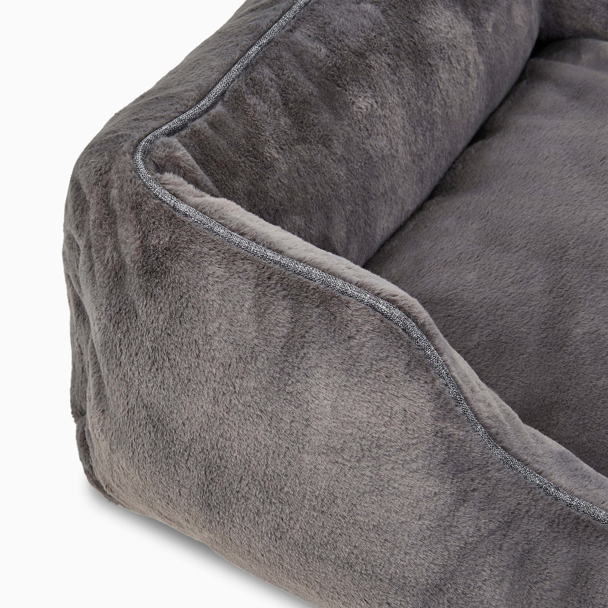 Close-up of a gray plush pet bed with soft texture