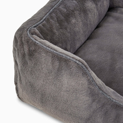 Close-up of a gray plush pet bed with soft texture