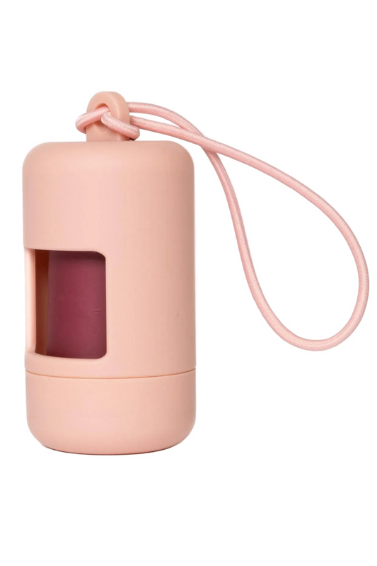 Pink dog waste bag container with a string on a white background
