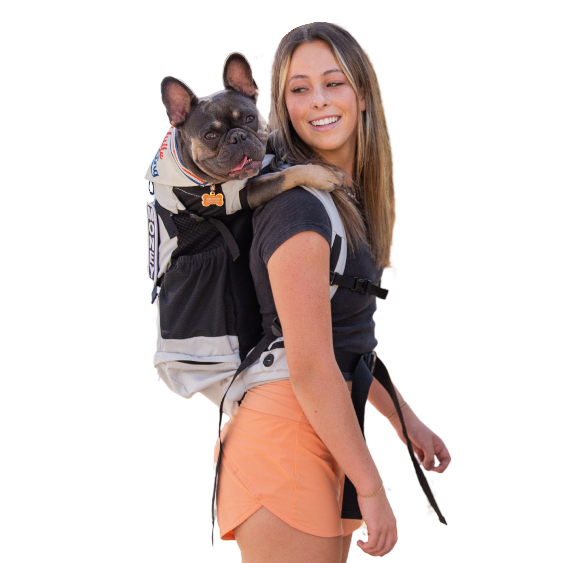 Woman carrying a small dog in a backpack on a white background