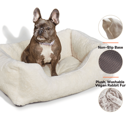 Dog sitting on a plush pet bed with non-slip base and plush washable vegan rabbit fur, on a white background.