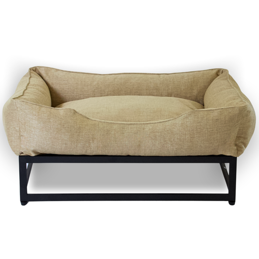 Beige pet bed with black metal frame on a white background