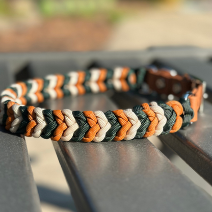 Dog collar with green, dark yellow, and cream braid, and light brown biothane strap
