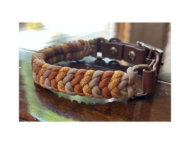Multicolored braided leather bracelet on a wooden surface