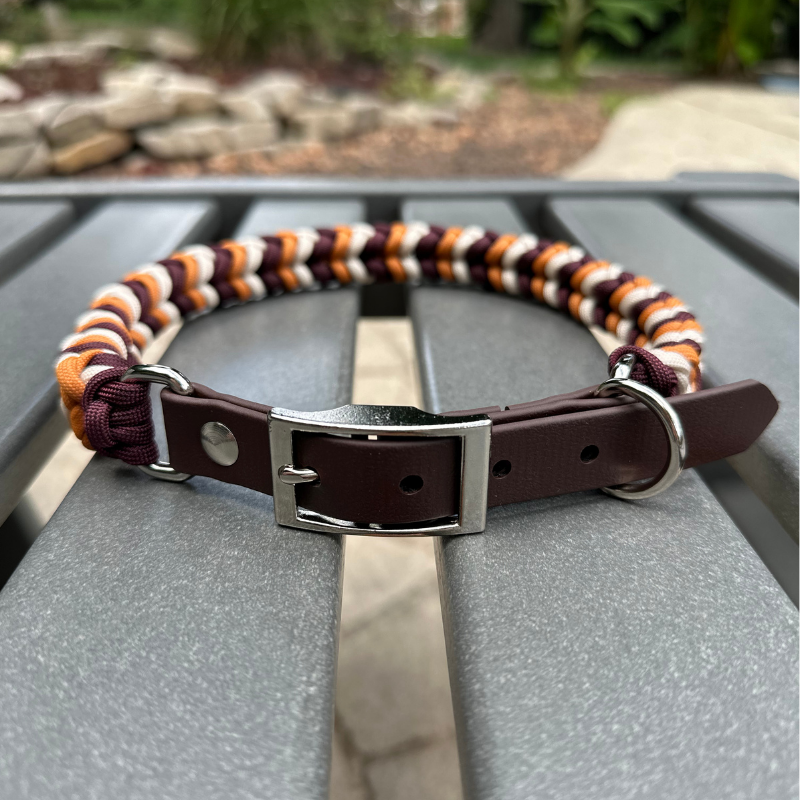 Dog collar with striped pattern on a metal surface