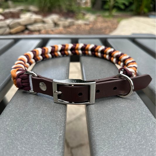 Dog collar with striped pattern on a metal surface