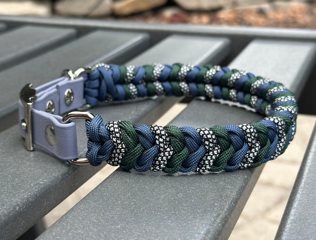 Dog collar with braided design on a metal surface