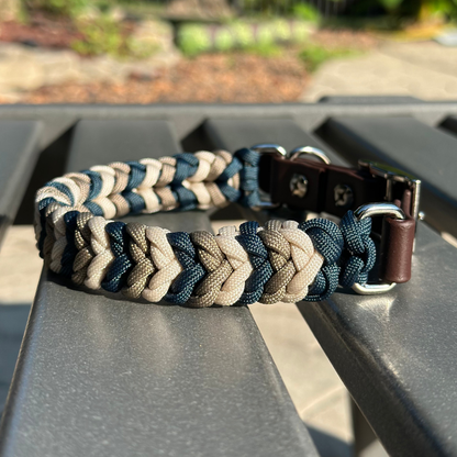 Dog collar with navy blue, tan, and cream braid, with medium brown biothane strap
