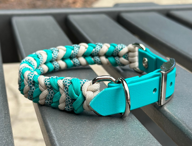 Teal and gray braided dog collar on a metal surface