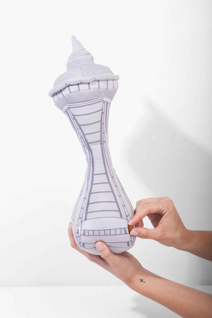 Dog In Seattle Nose Work Dog Toy with woman's hands putting treats in toy on white background