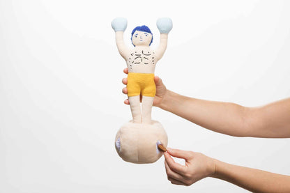 Champ Rocky Nose Work Dog Toy with woman's hands putting treat in toy on white background