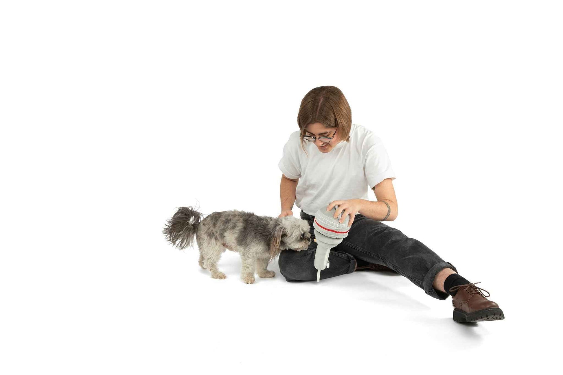 The Six Nose Work Dog Toy on white background with woman playing with dog