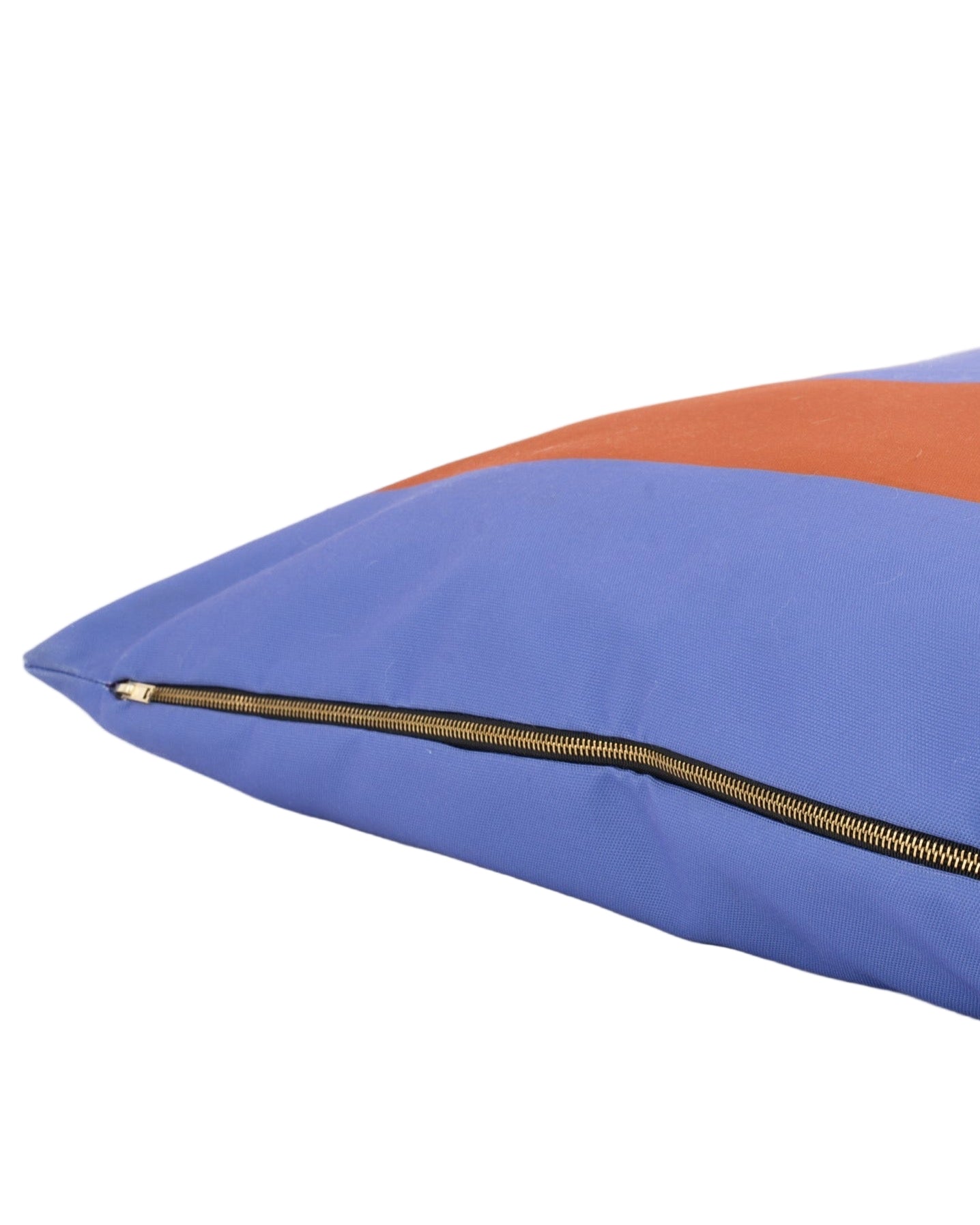 Blue and orange pillow with a zipper on a white background