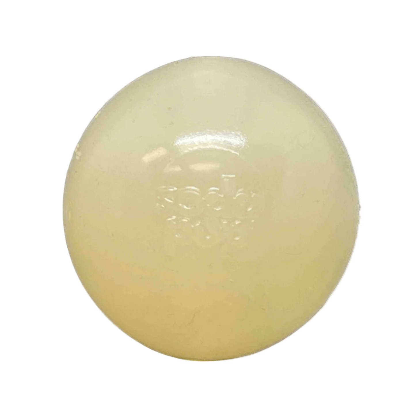 Round, beige-colored dog toy ball on a white background