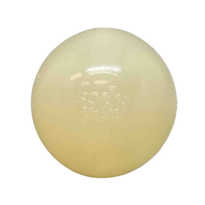 Round, beige-colored dog toy ball on a white background