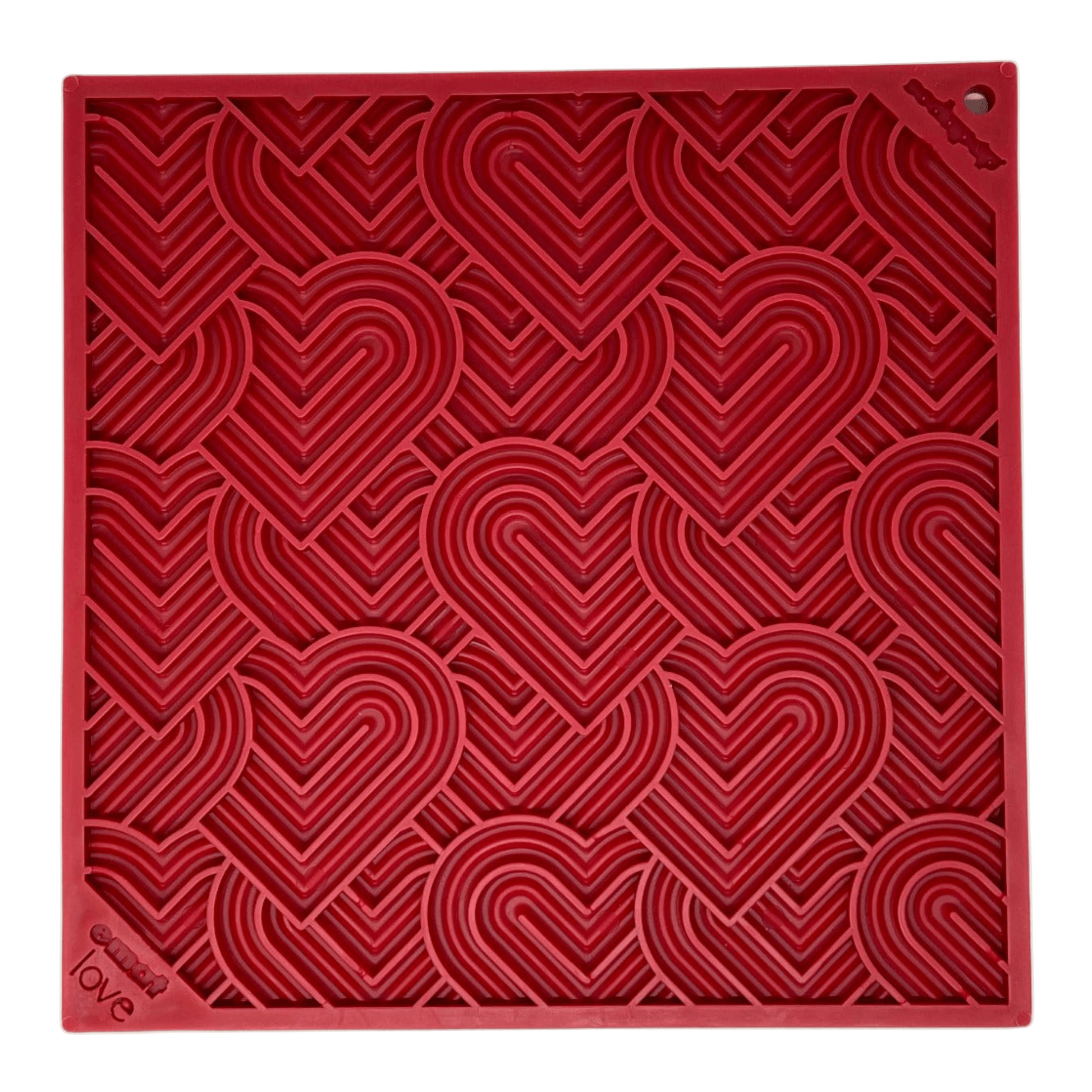 Red textured dog lick mat square with heart patterns on a beige background