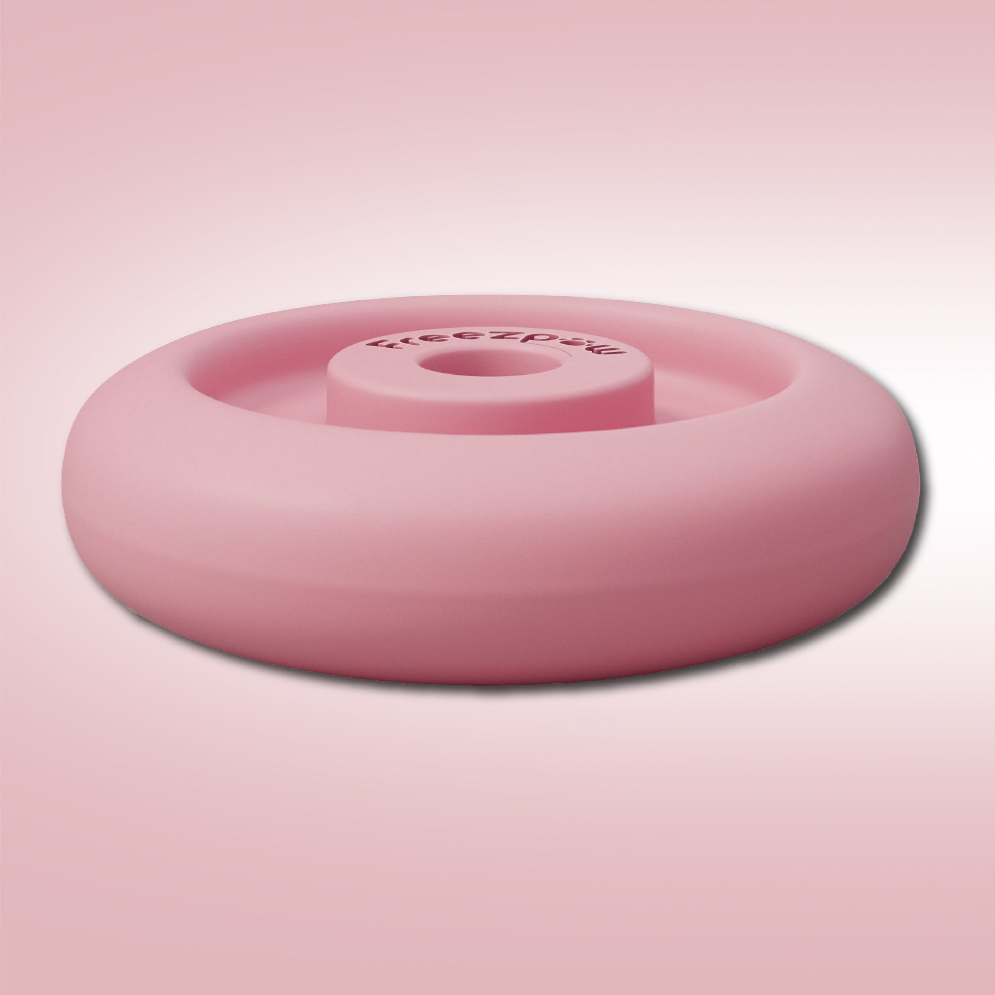 Pink dog toy with 'Freeze Paw' branding on a pink background