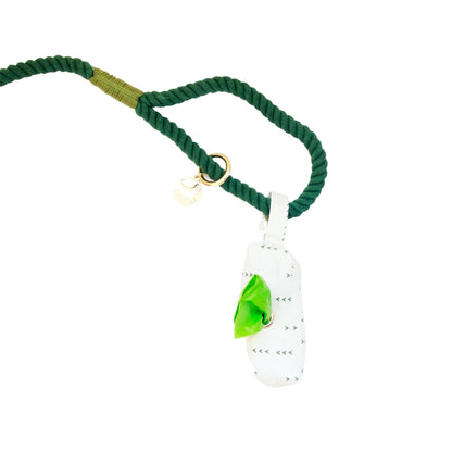 Green rope necklace with a white pendant featuring a green leaf on a white background