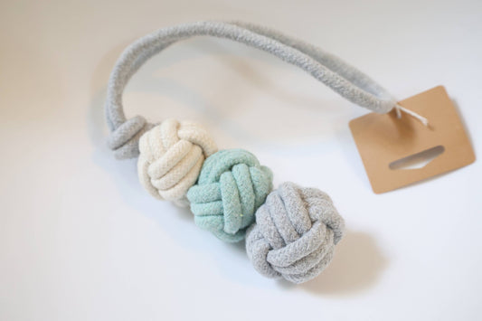 Textured dog toy with knotted design on a white background