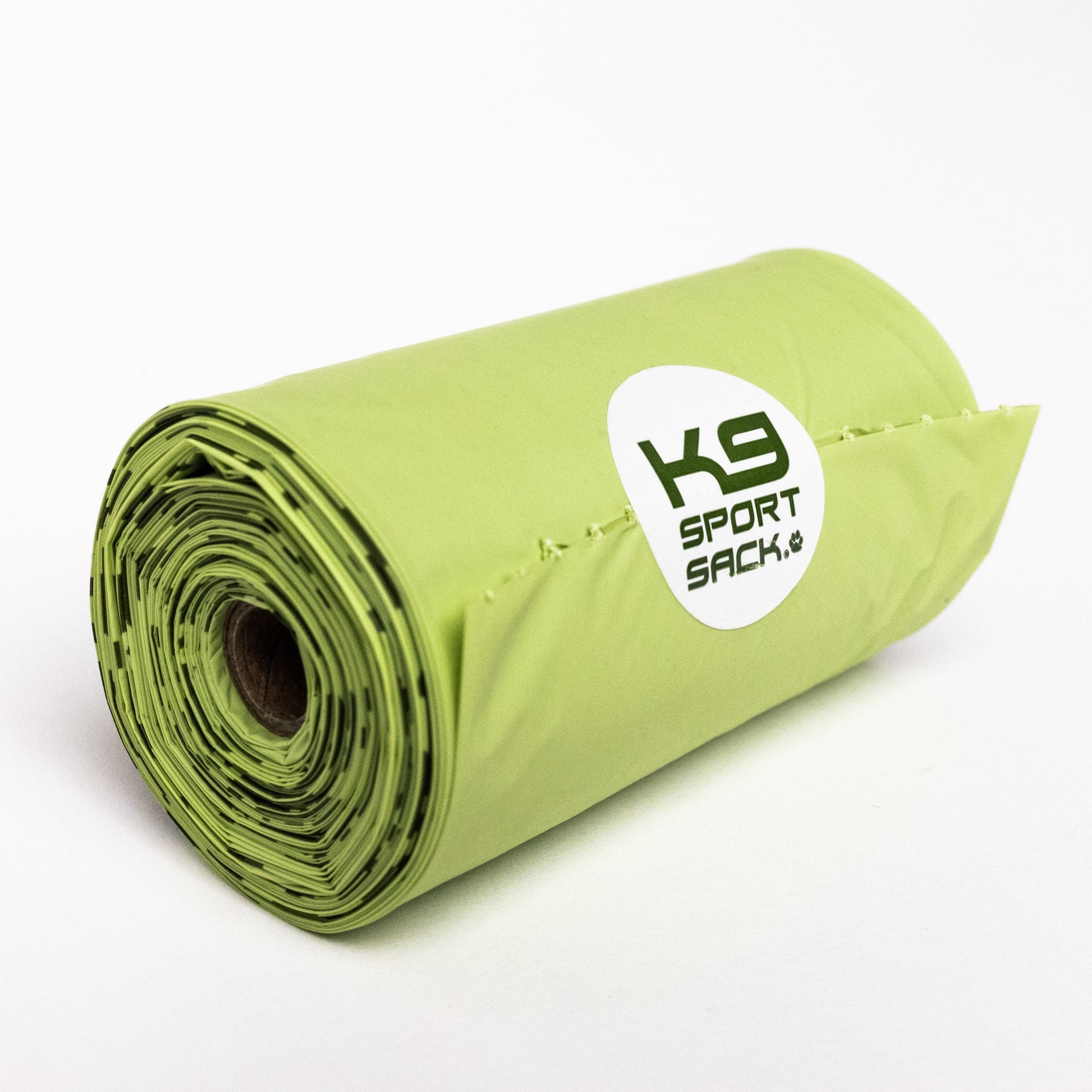 Roll of green K9 Sport Sack on a white background