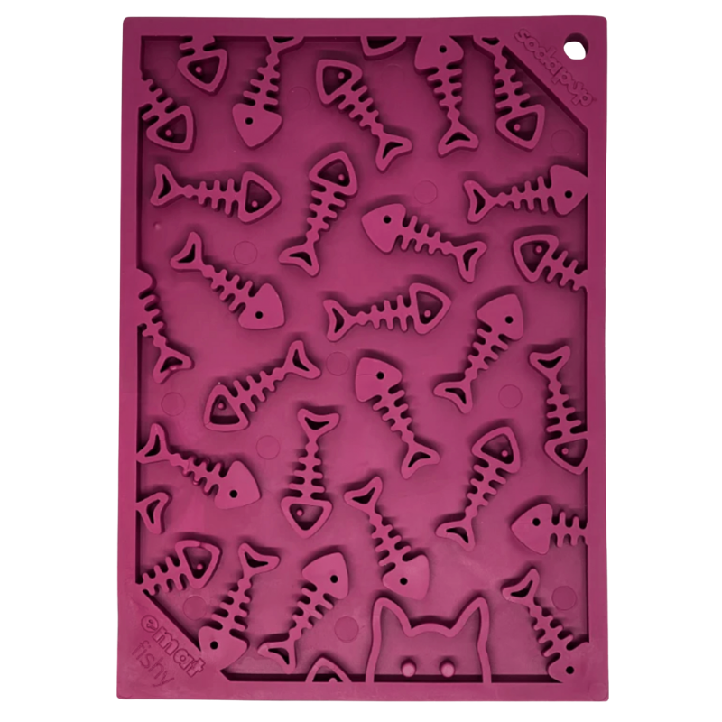 Pink silicone dog lick mat with fish skeleton designs on a white background