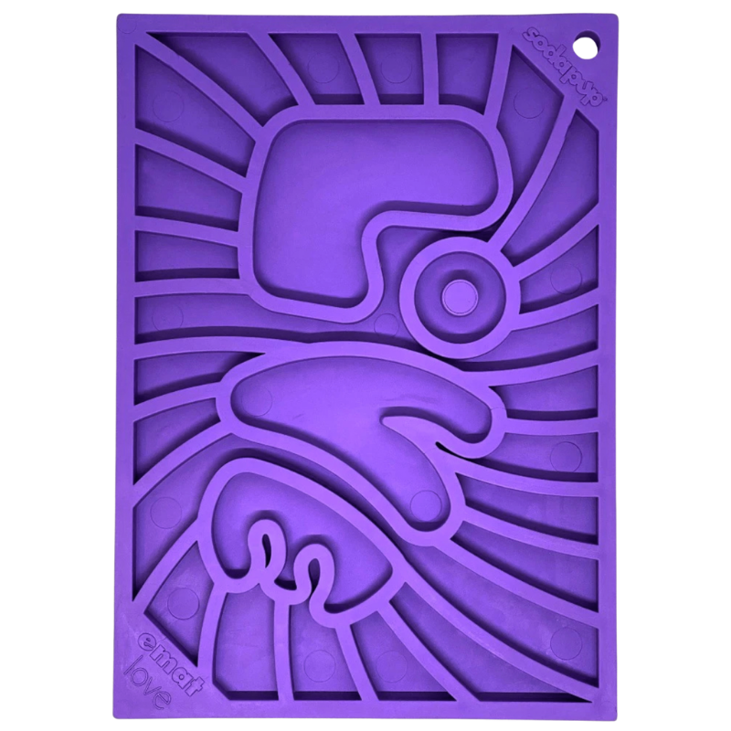 Purple silicone dog lick mat with geometric "Love" design on a white background