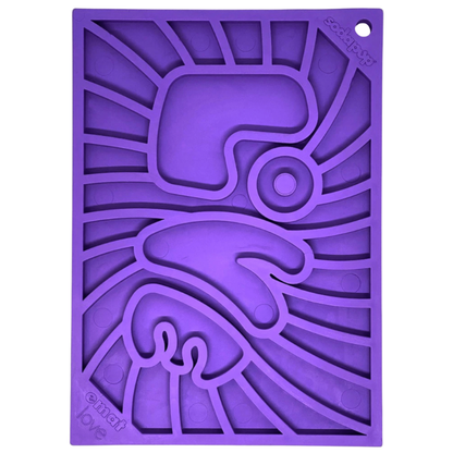 Purple silicone dog lick mat with geometric "Love" design on a white background