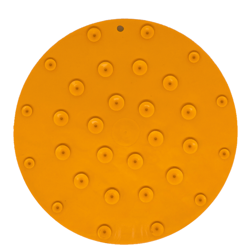 Orange dog lick mat with raised suction cups on a white background