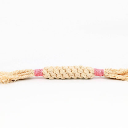 Braided toy rope with a pink center on a white background