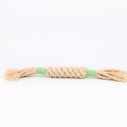 Beige dog toy rope with green accents on a white background