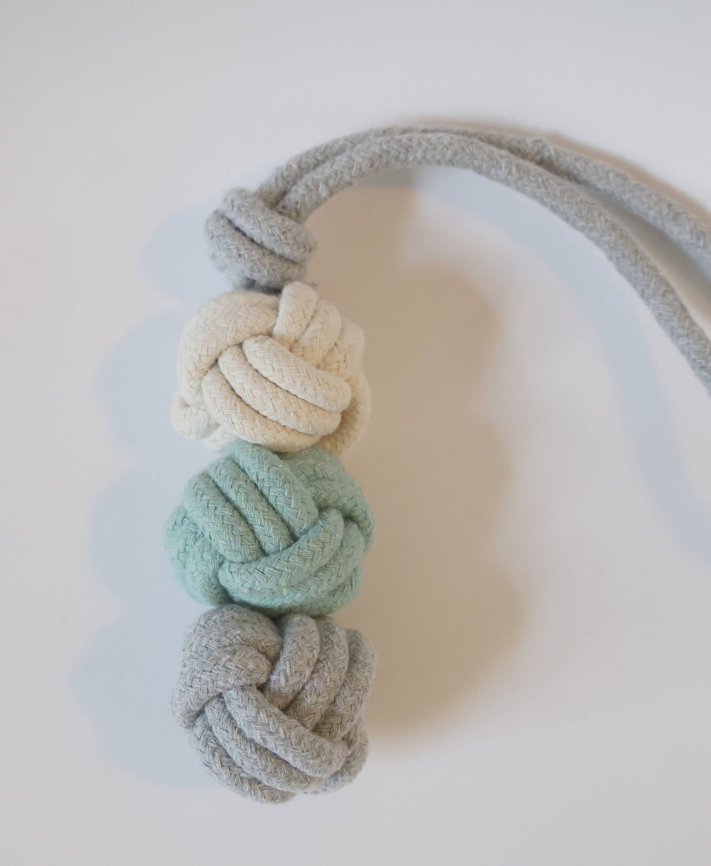 Rope dog toy on a white background