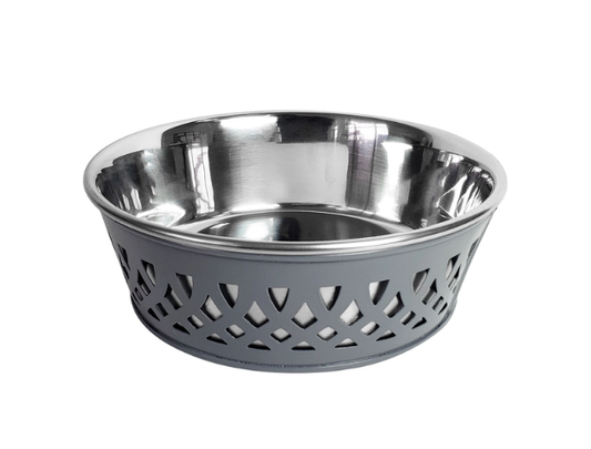Stainless steel bowl with perforated design on a white background